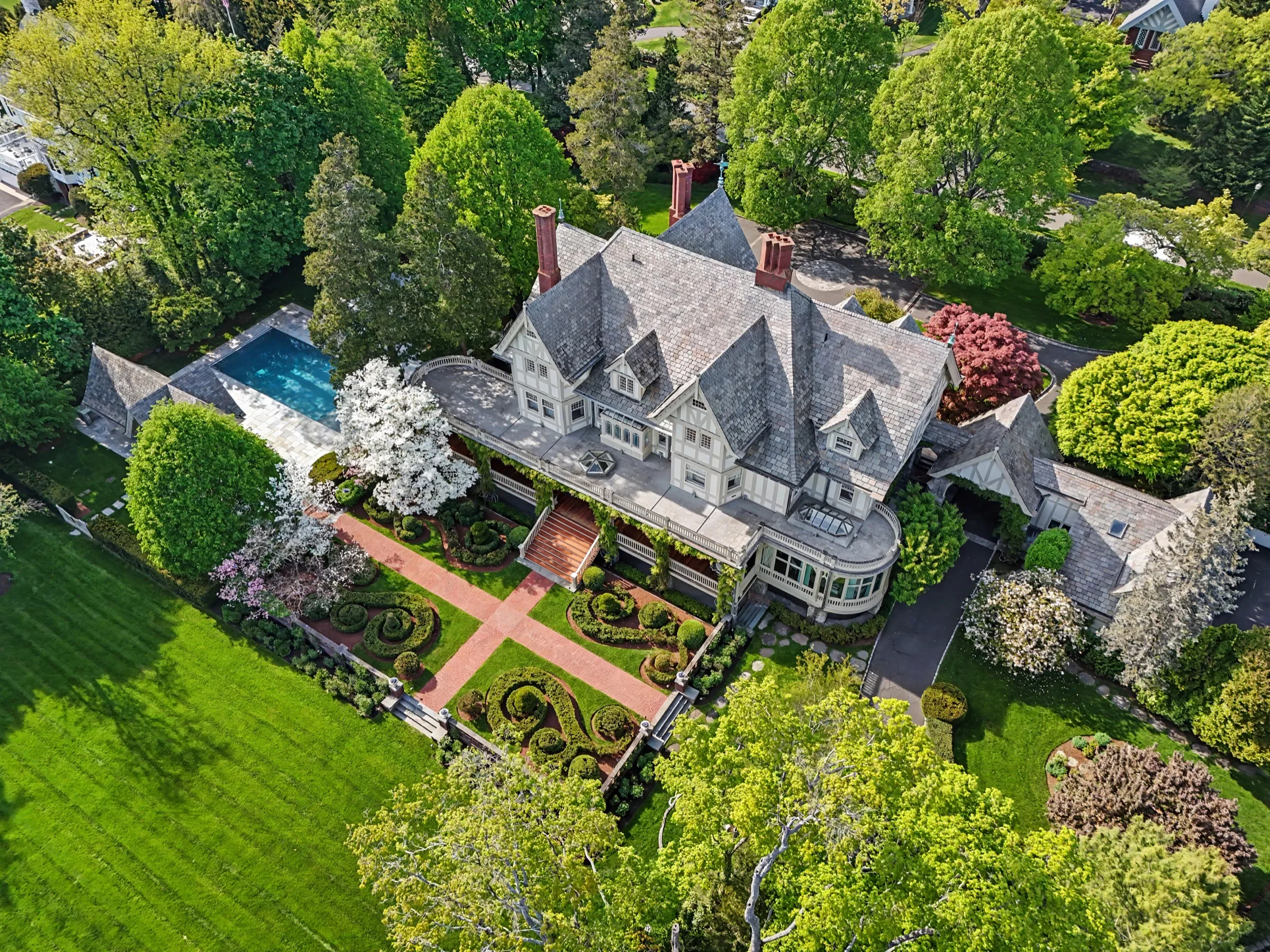 Aerial drone view of a $20 million estate — property and surrounding neighborhood, Westchester County NY