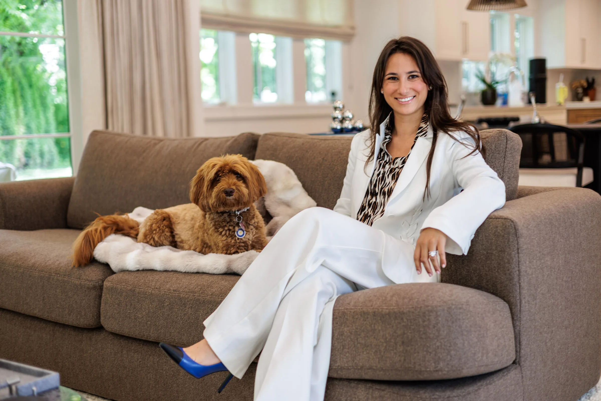 Agent lifestyle portrait with dog — environmental photography in home setting, Westchester County NY