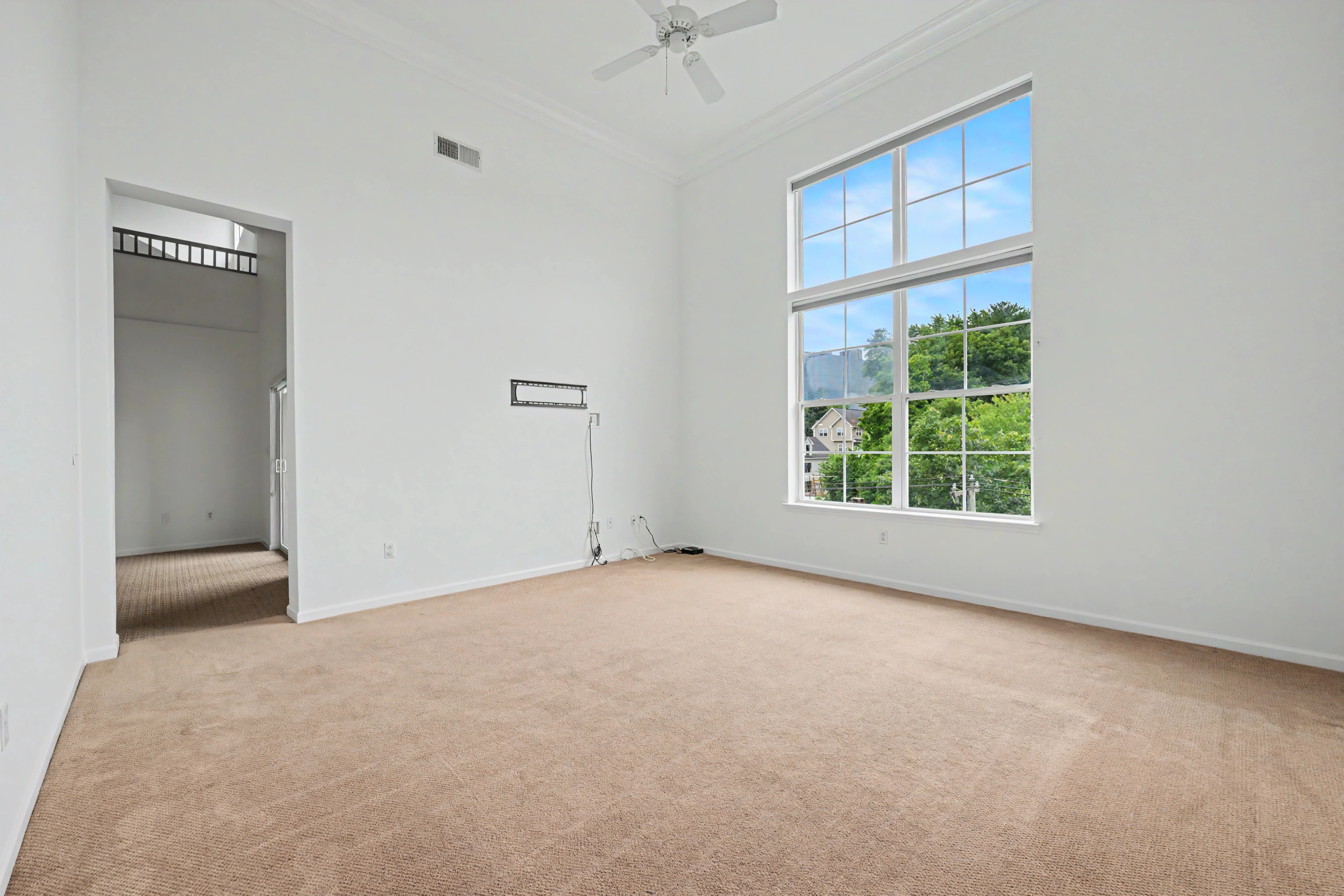 Living space photographed unfurnished — before virtual staging
