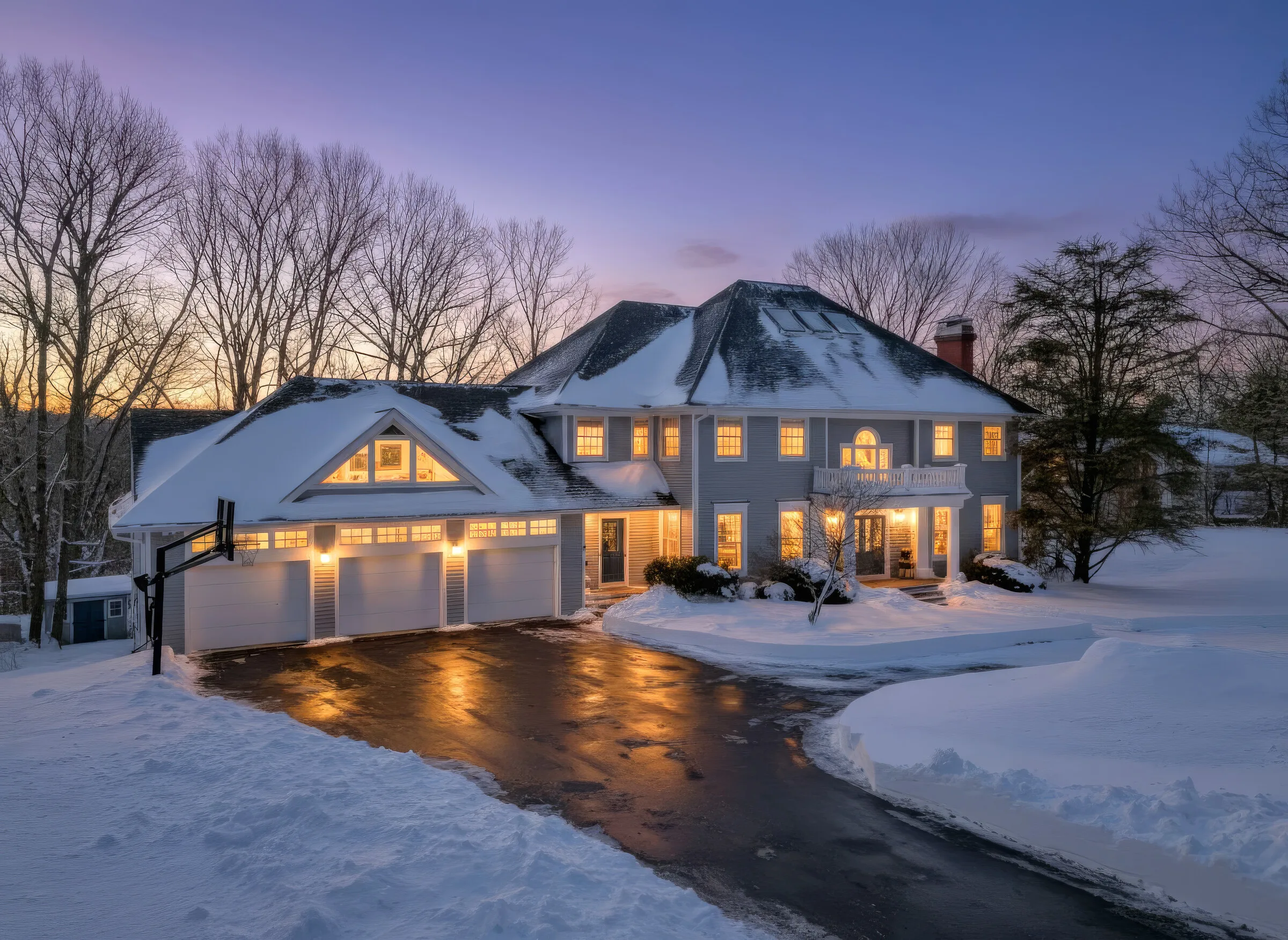 Virtual twilight exterior with snow — dusk sky, warm window glow, winter listing photography, Westchester County NY