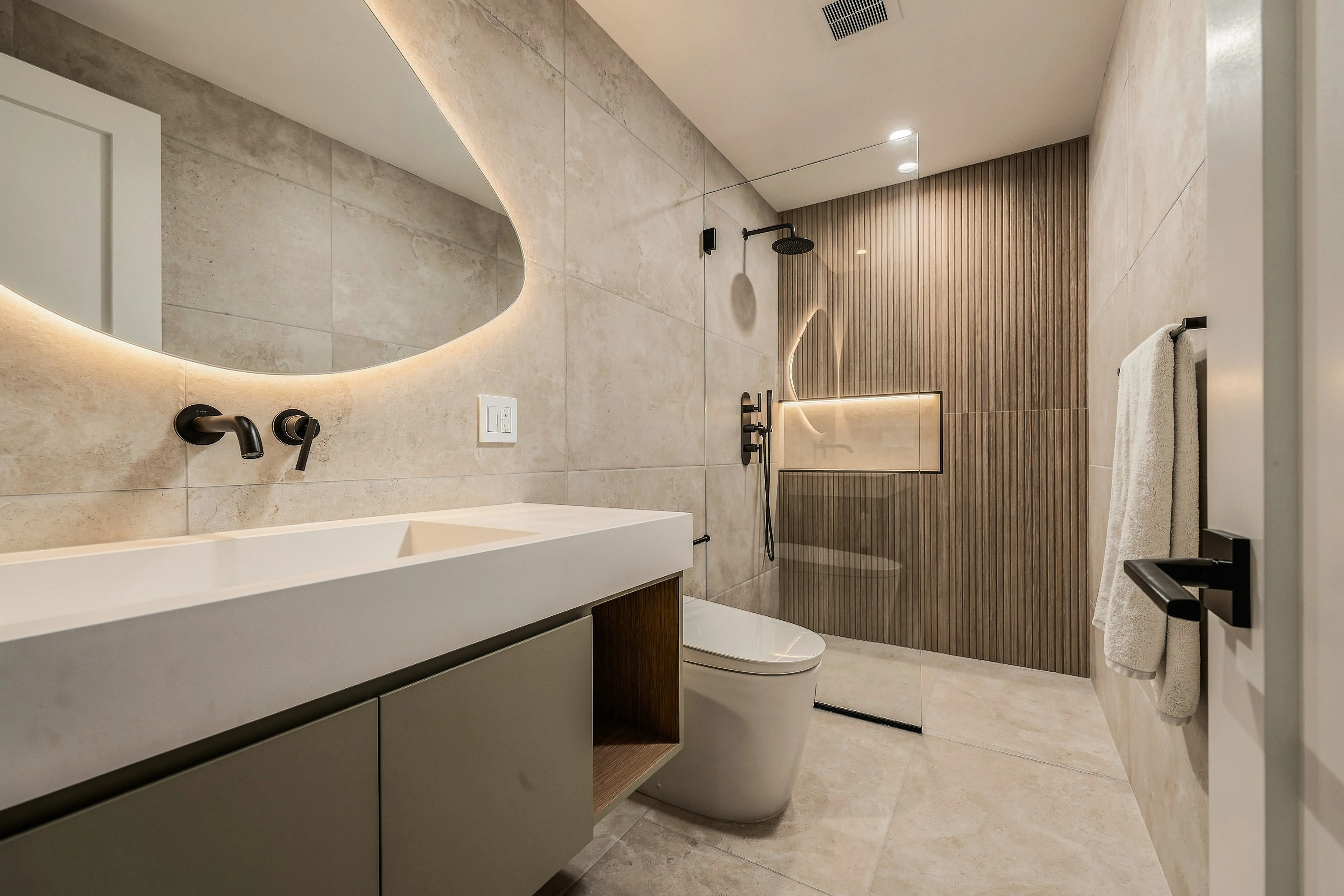 Modern bathroom with sculptural mirror, floating vanity, and ribbed wood-tile shower wall — premium cinematic real estate photography